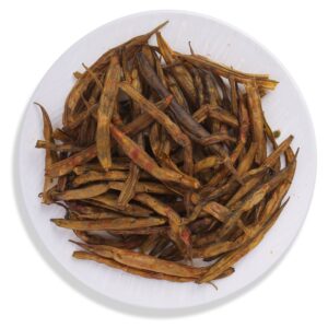 HealthyGrabz cluster bean chips on a white plate - sun dried air fried gavar snack